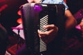 The musician plays the accordion close-up microphone. Royalty Free Stock Photo