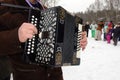 The musician plays accordion on the feast of Maslenitsa. Royalty Free Stock Photo