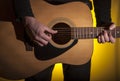 musician plays acoustic guitar