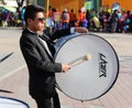 Musician plays big drum.