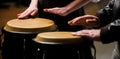 The musician plays the bongo. Close up of musician hand playing bongos drums. Afro Cuba, rum, drummer, fingers, hand Royalty Free Stock Photo