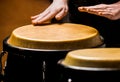 Musician plays the bongo. Close up of musician hand playing bongos drums. Afro Cuba, rum, drummer, fingers, hand, hit