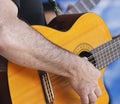 A Musician Plays a Classical Cutaway Guitar