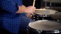 Musician plays drams in slow motion