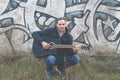 Musician plays an elegant black guitar, Spain