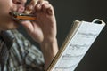 Musician plays the harmonica Royalty Free Stock Photo