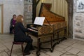 Musician plays the harpsichord