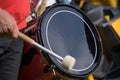 Musician plays the kettledrum in a corps of drums, motion blur