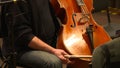 Musician preparing violancello to play in the orchestra