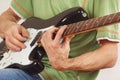 Musician put fingers for chords on electric guitar close up Royalty Free Stock Photo