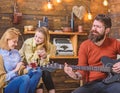 Musician putting all heart into his art. Bearded man singing passionately love song. Girls enjoying touching performance Royalty Free Stock Photo