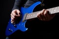 Musician rock guitarist playing a blue guitar Royalty Free Stock Photo