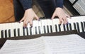 Musician`s female hands with manicure and white black piano keys while playing music Royalty Free Stock Photo