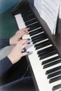 Musician`s female hands with manicure and white black piano keys while playing music Royalty Free Stock Photo