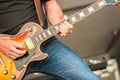 Musician strumming an electric guitar Royalty Free Stock Photo