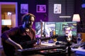 Musician teaching guitar lessons on internet with tutorials for social media pages
