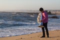 Musician with Tuba on the ocean coast. Sad. Royalty Free Stock Photo