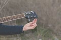 Musician tune the strings of an elegant black guitar, Spain Royalty Free Stock Photo