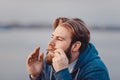 The musician who plays ethnic instruments. bearded man playing the jew`s harp. Royalty Free Stock Photo