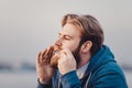 The musician who plays ethnic instruments. bearded man playing the jew`s harp. Royalty Free Stock Photo