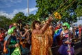 Musician woman covered with tinsel playing trombone at Bloco Orquestra Voadora in Flamengo Park, Carnaval 2017