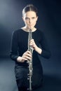 Musician woman playing oboe musical instrument