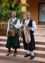 Musicians and dancers in national costumes perform for tourists and citizens at the village fair, Spain