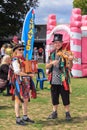 Musicians dressed as jesters at a fair Royalty Free Stock Photo