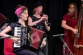 Musicians with the London Klezmer Quartet playing klezmer music during a faculty concert at the Klezfest music festival, London UK