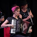 Musicians with the London Klezmer Quartet playing klezmer music during a faculty concert at the Klezfest music festival, London UK