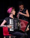 Musicians with the London Klezmer Quartet playing klezmer music during a faculty concert at the Klezfest music festival, London UK