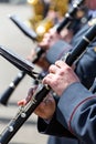 Musicians in military orchestra playing on clarinet