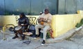 Musicians play music for tips on the street in the famous Plaka neighborhood in Athens, Greece Royalty Free Stock Photo