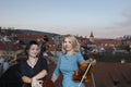 Musicians play the violin and contrabass Image on the background of the city