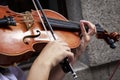 Musicians playing string instruments in the streets Royalty Free Stock Photo