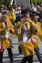 Musicians in yellow dresses on the Japanese traditional parade on EXPO 2015