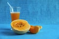 Muskmelon fruit and juice isolated on light blue background