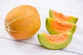 Muskmelon sliced cantaloupe thai tropical fruit asian on wood background - melon yellow Royalty Free Stock Photo