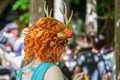 2019_06_02_ Muskogee USA Beautiful girl dressed as woodland fantasy creature with bright red curls and horn headpiece and pointed