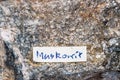 A Muskovit gemstone sparkling because of high content of metal elements label Royalty Free Stock Photo