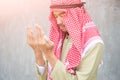 Muslim arabic man praying, prayer concept for faith, spirituality and religion.