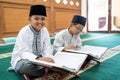 Muslim asian kid bestfriend reading quran