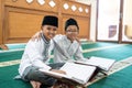 Muslim asian kid bestfriend reading quran