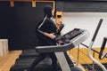 Muslim asian woman in hijab exercizing in a gym. Royalty Free Stock Photo