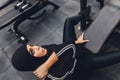 Muslim asian woman in hijab exercizing in a gym. Royalty Free Stock Photo