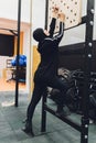 Muslim asian woman in hijab exercizing in a gym.