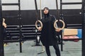 Muslim asian woman in hijab exercizing in a gym.