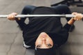 Muslim asian woman in hijab exercizing in a gym. Royalty Free Stock Photo