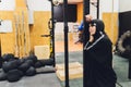 Muslim asian woman in hijab exercizing in a gym.