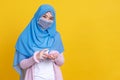 Muslim Asian woman with traditional dress wearing medical face mask Royalty Free Stock Photo